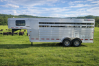 A 2020 Exiss 7HX2H livestock trailer at Frontier Trailers & Roping Supply, highlighting its spacious and robust construction.