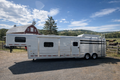 2021 Exiss 710HQ four-horse trailer displayed at Frontier Trailers & Roping Supply, showcasing its sleek design and features.