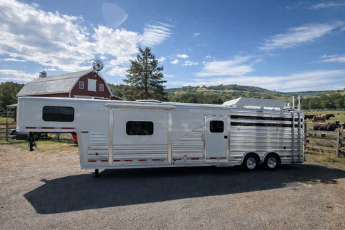 2021 Exiss 710HQ four-horse trailer displayed at Frontier Trailers & Roping Supply, showcasing its sleek design and features.