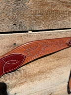 Shane Deater custom breast collar detailed view showing floral tooled leather pattern and stitched accent on western horse tack.